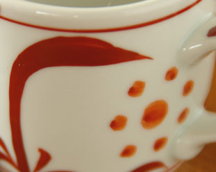 砥部焼・梅山窯 赤太陽のコーヒーカップの絵柄